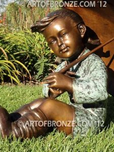 Summer Breeze bronze sculpture of cute young girl in the sun with umbrella