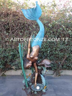 Bronze mermaid fine art sculpture holding oyster shell for pond, pool or aquatic display