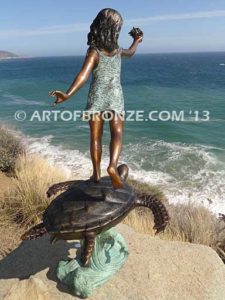 A Treasured Day Bronze sculpture of whimsical girl on turtle playing with seashell