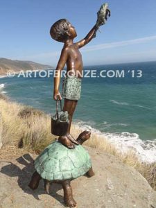 A Day to Remember Bronze sculpture of whimsical boy on turtle holding bucket of bullfrogs