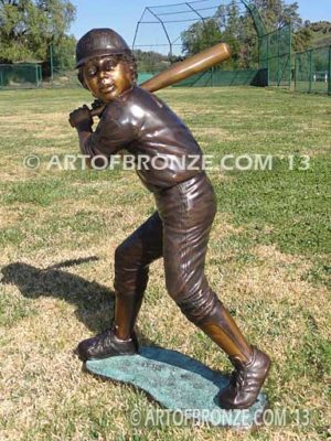 Home Run bronze sculpture of boy playing baseball hitting ball