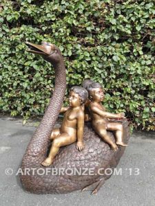 Fantasy bronze sculpture of playing cherubs on graceful swan