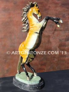 Sunfire sculpture of reared horse with contemporary brilliant patina coloring attached to marble base