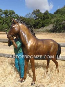 Dreams Come True bronze sculpture of girl petting her pony horse