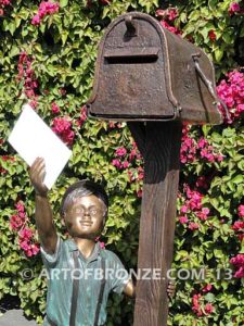 Letter to Grandma sculpture of dog and boy putting letter to grandma in mailbox