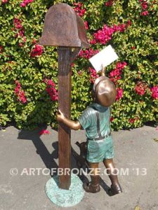 Letter to Grandma sculpture of dog and boy putting letter to grandma in mailbox