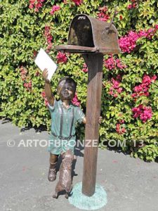 Letter to Grandma sculpture of dog and boy putting letter to grandma in mailbox