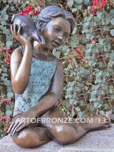 Ocean Sounds bronze sculpture for pool, garden or yard of young child holding conch shell