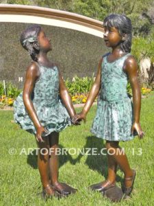 Dance Partners bronze sculpture of two ballerinas holding hands