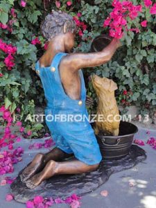 Bath time bronze sculpture fountain of boy washing his dog