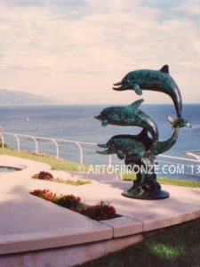 Soul Surfers marine life bronze cast three dolphin sculpture monument