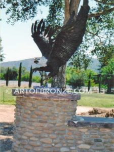 Alaskan Dinner bronze sculpture of monumental life-size eagle.