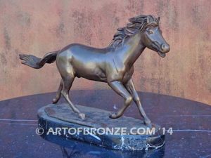 Untamed Spirit sculpture award of charging horse attached to a marble base