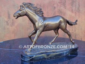 Untamed Spirit sculpture award of charging horse attached to a marble base