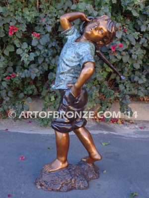 Strolling Along bronze sculpture of boy helping in garden watering flowers