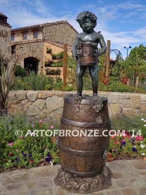 Harvest Time bronze sculpture of cherub boy standing on wine barrel with grapes