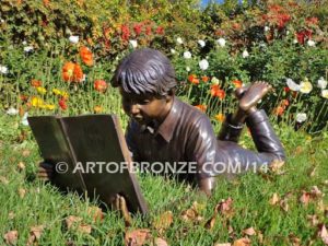 Best in His Class bronze sculpture of young boy reading his favorite novel