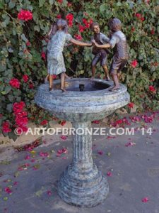 Playground Joy bronze fountain sculpture of kids dancing around