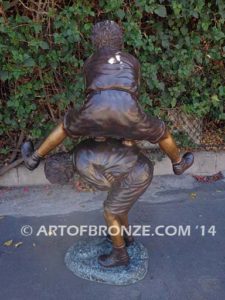 Leapfrog bronze sculpture of two kids playing leapfrog