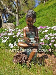 Blooming Youth front view bronze sculpture of young ballerina sitting tying her slipper