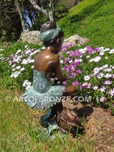 Blooming Youth back view A bronze sculpture of young ballerina sitting tying her slipper