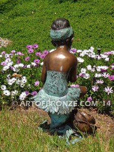 Blooming Youth back view B bronze sculpture of young ballerina sitting tying her slipper