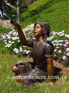 Wings of Joy bronze sculpture of sitting girl in dress with bronzes butterflies