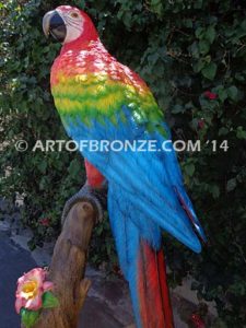 Scarlet Macaw outdoor statue of life-size wild Macaw on a branch