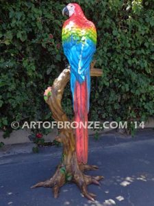 Scarlet Macaw outdoor statue of life-size wild Macaw on a branch