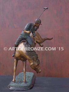 Change of Direction sculpture of polo player riding his leaping polo pony attached to a marble base