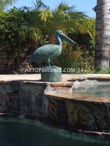 Fisherman bronze statue of tranquil pelican on bronze piling