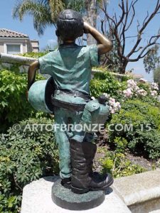 Home of the Brave bronze sculpture of saluting boy dressed up playing soldier