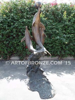 Game Play heroic bronze fine art gallery sculpture of leaping dolphins