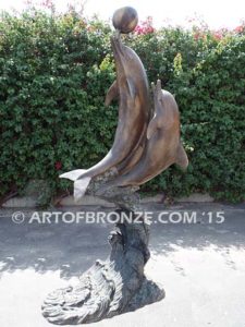 Game Play heroic bronze fine art gallery sculpture of leaping dolphins