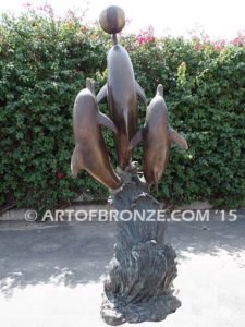 Game Play heroic bronze fine art gallery sculpture of leaping dolphins