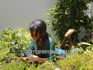 Best in Her Class OC bronze statue of girl lying down reading book