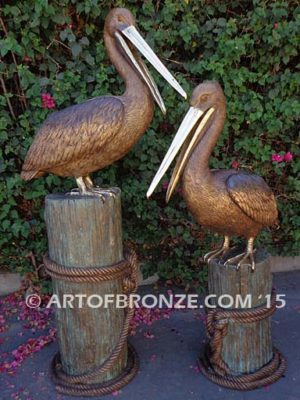 Pelican Pilings bronze statue of playful pelicans on bronze pilings