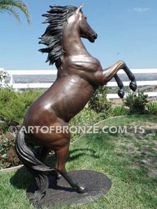 Thunderstorm sculpture of reared horse with forelegs off the ground and hind legs attached bronze base