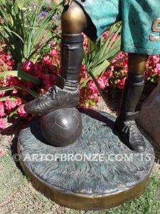 Soccer Star bronze sculpture of AYSO soccer player getting ready to play his game