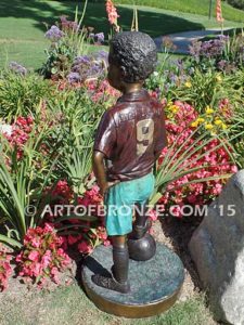 Soccer Star bronze sculpture of AYSO soccer player getting ready to play his game