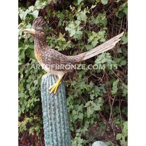 Desert Life (Roadrunner) life-size statue of a bronze cactus with a roadrunner on top of it