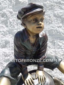 Leapfrog bronze sculpture of boy jumping over his brother