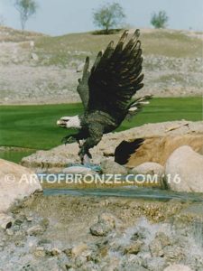 Alaskan Dinner bronze sculpture of monumental life-size eagle.