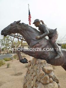 Show Jumper Olympic equestrian bronze horse and rider equestrian statue for Griffin Ranch in La Quinta, CA