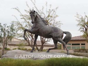 Striking Freedom bronze monument sculpture of assertive stallion horse for Griffin Ranch in La Quinta, CA