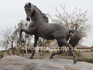 Striking Freedom bronze monument sculpture of assertive stallion horse for Griffin Ranch in La Quinta, CA