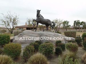 Striking Freedom bronze monument sculpture of assertive stallion horse for Griffin Ranch in La Quinta, CA