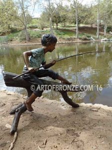 Fish n Day bronze sculpture of young boy sitting on log fishing