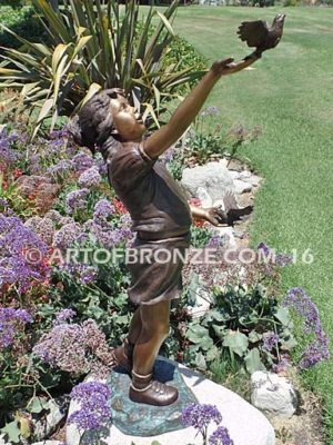 Faith and Hope bronze statue of young standing girl with doves in her hands