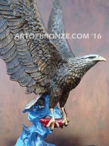 Bronze sculpture of flying eagle with captured salmon on custom marble base